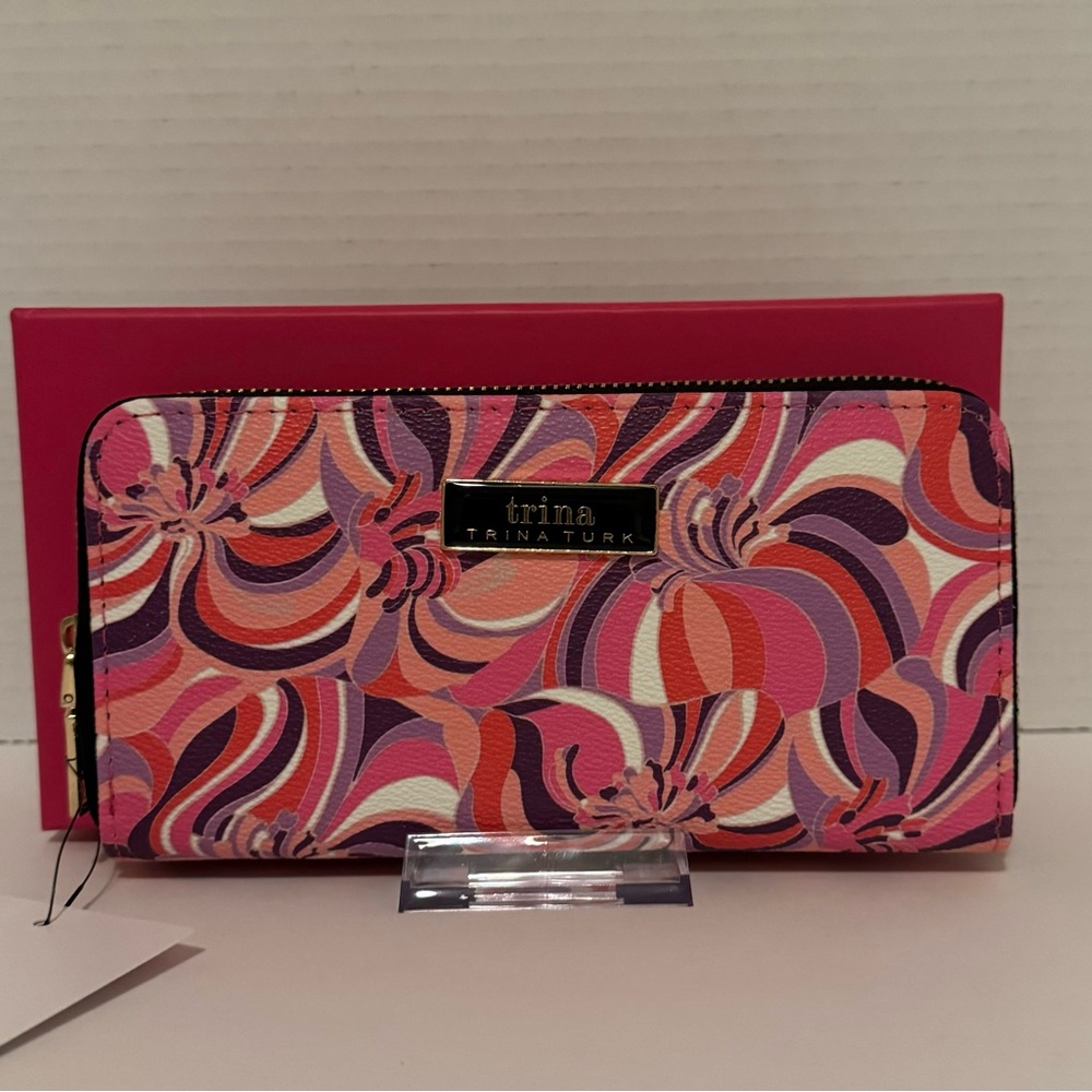 All around zip. Long wallet. NWT. Giftable Box. Plenty of room. Awesome colors